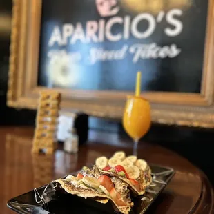 Fruit breakfast tacos and OJ!