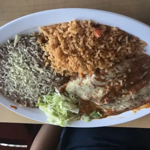 Cheese enchilada comes w rice and beans