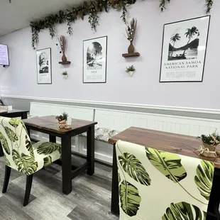 a dining area with tables and chairs