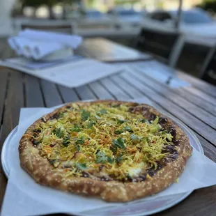 a pizza on a plate on a table