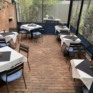 outdoor dining area with tables and chairs