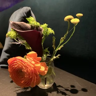 a vase of flowers on a table