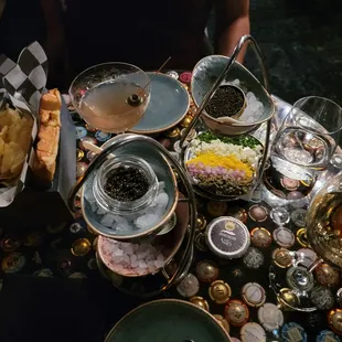 Clockwise from bottom left: French caviar, martini, Uruguayan imperial (very good), accoutrements. Bottom right corner: glass of Champs.