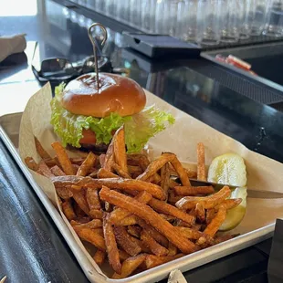 a tray of fries and a burger