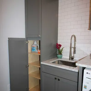 Laundry room with our grey shaker style cabinetry