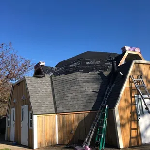 Installing the underlayment &amp; the new shingles.