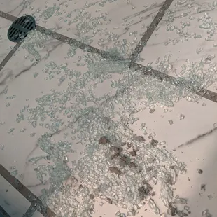 Shower floor after door shattered.