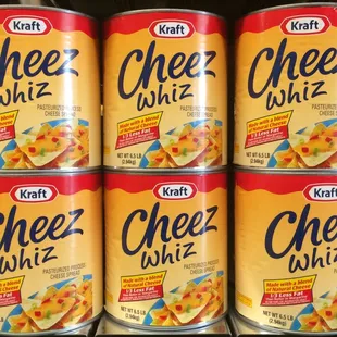 four cans of cheez whiz