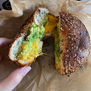 bagel breakfast sandwich with egg, cheese, and avocado