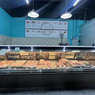 a display of pizzas and pastries