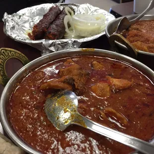 Closeup of chicken tikka (center) and goat karahi (right)