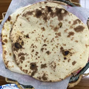 two flat breads on a table