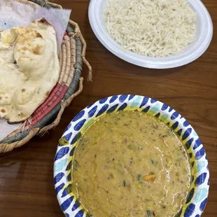 a bowl of soup and a plate of rice