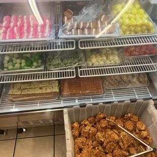 Sweets counter with some other foods out front