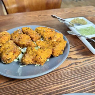 Fish Pakora. $11 fried salmon. Tasty, but the breading reminded me of chicken nuggets. Served with various chutneys.
