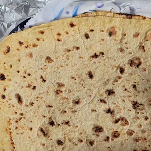 Roti is thin, with butter, just like how mom would cook it.