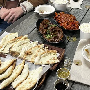 Goat curry, chicken tikka masala, naan, mint and tamarind chutney.
