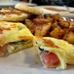 Small omelet, potatoes and biscuit.