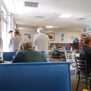 diners sitting at tables in a restaurant