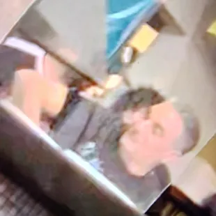 the reflection of a man in the mirror