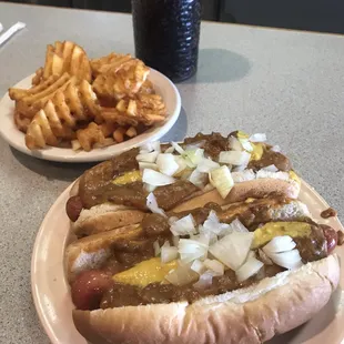 A couple coneys, some waffle fries &amp; an ice cold cola.