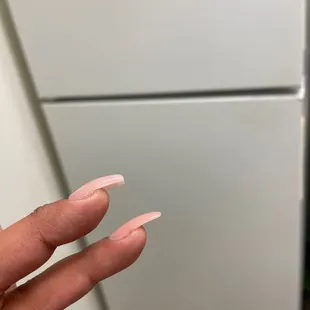 The bottom nail is the original and the top is one of the ones I had to pay to get fixed.