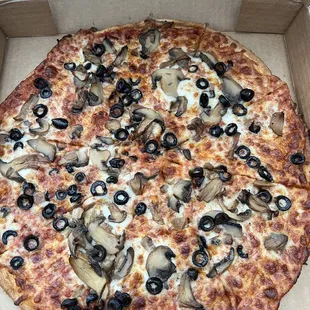 Gluten Free Cauliflower Crust Pizza with mushrooms and olives