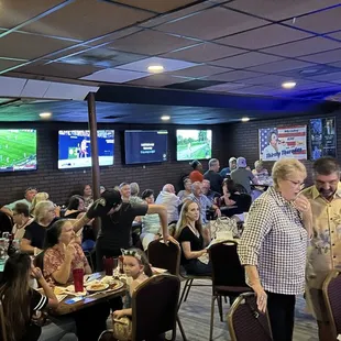 a large group of people sitting at tables