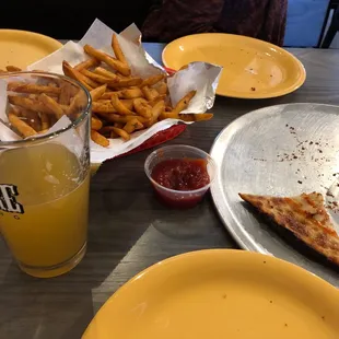What's left of the cauliflower crust (thumbs up). Catching the Wildcats game!