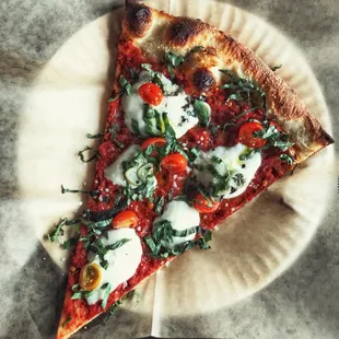 The Venustiano without Italian Sausage. Photographed with spicy arrabiata sauce, fresh mozzarella, garlic and organic grape tomatoes &amp; basil