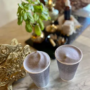 two cups of coffee on a table