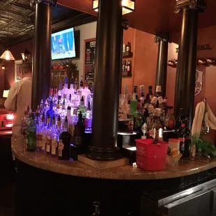 a bar with a large television