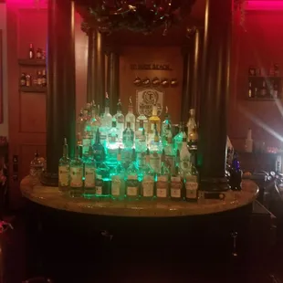 a bar filled with bottles of liquor