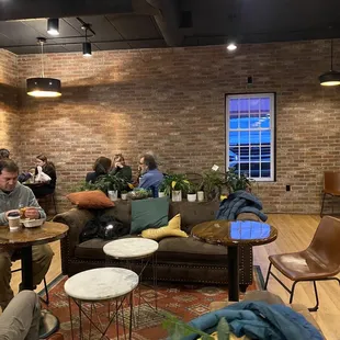 a group of people sitting in a coffee shop