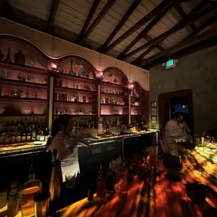 two people sitting at a bar