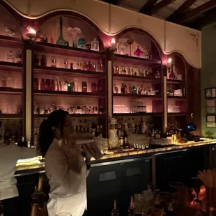 a woman sitting at a bar