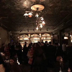 a crowd of people in a dimly lit room