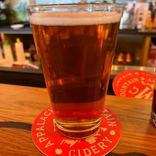 a pint of beer on the bar