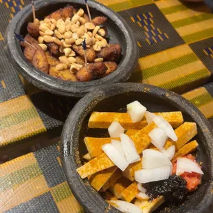 Yam chips (bottom), Kelewele/fried plantain (top).