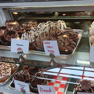 a variety of cupcakes on display