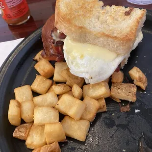 Sunrise sandwich with italian bread, swiss cheese, and bacon. Side is House fries