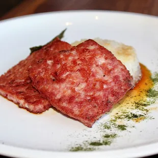 The Housemade Spam is made with pan fried rice cake, rhubarb amba, nori, &amp; smoked pork tare.