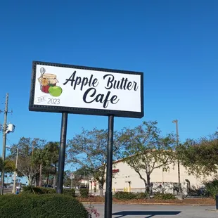 a sign in front of a building