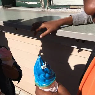 a woman holding an ice cream cone