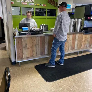 a man standing at the counter