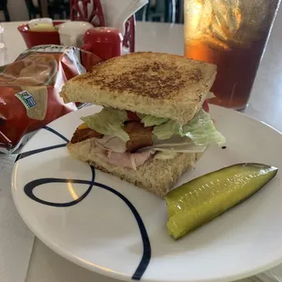 Ham and Turkey club with bacon! Lunch special, Half sandwich with chips and tea for $8.95