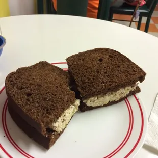 Chicken Salad on pumpernickel bread with homemade lemon aid .