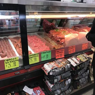 a woman looking at meat