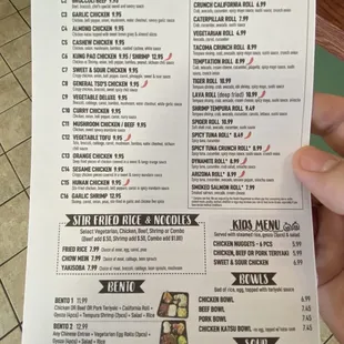 a hand holding a menu