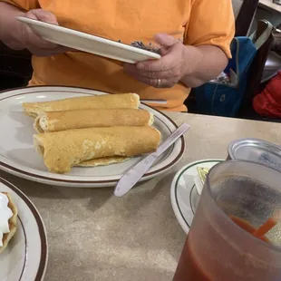 Adult Pigs in a blanket . Sausage wrapped in pancakes.